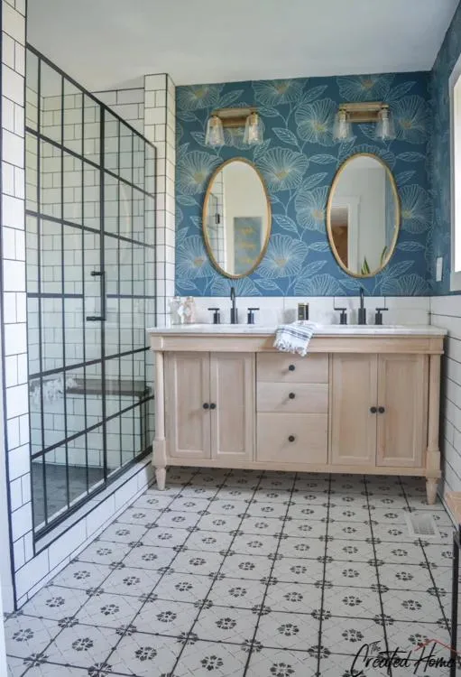 Bathroom with a modern design featuring a shower, sink, and a stylish tile backsplash.