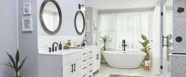 Bathroom featuring white walls, a walk-in shower, and a contemporary design.