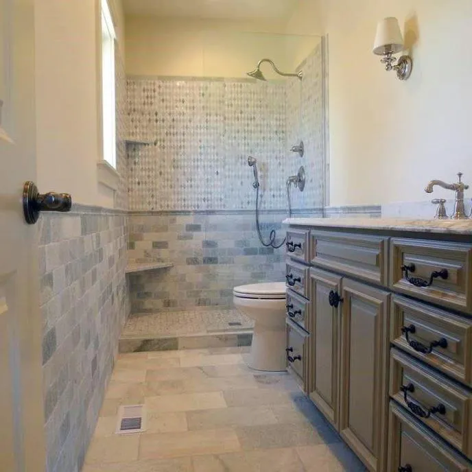 Bathroom renovation showcasing a spacious layout with a walk-in shower, double sink vanity, and tiled walls.