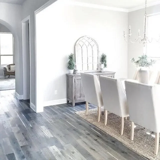 Hardwood flooring with a rich brown color and prominent grain pattern.