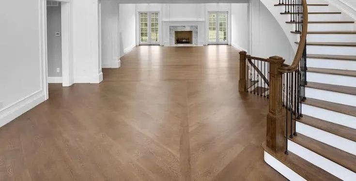 Finished hardwood flooring in a bright interior