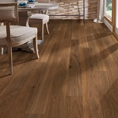 Hardwood flooring with a focus on the planks' width, color variation, and matte finish.