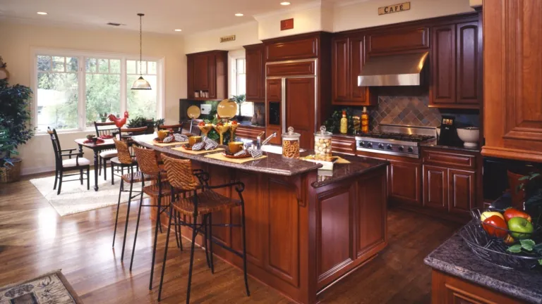 Brown hardwood floor with visible grain and high shine.
