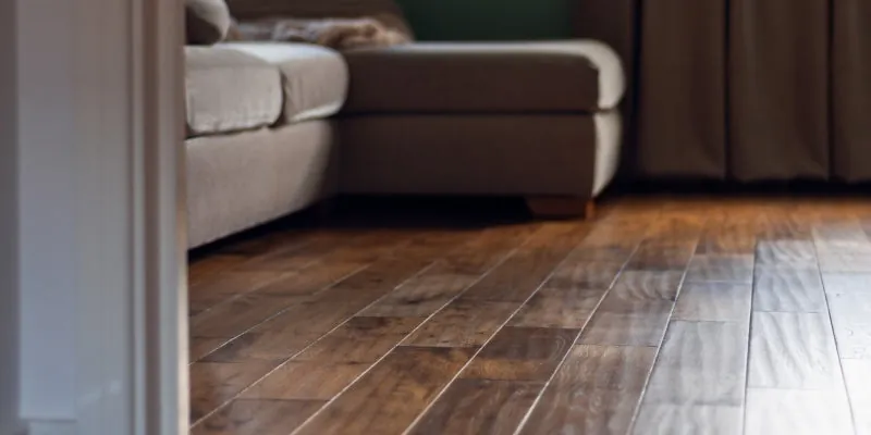 Hardwood flooring with a rich, dark stain and a glossy finish.