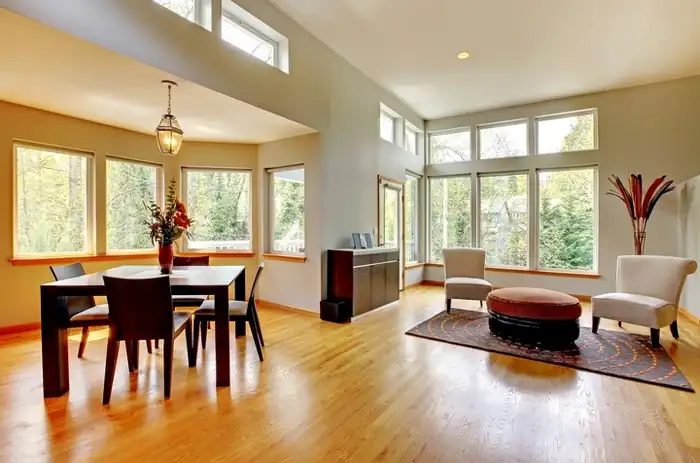 Hardwood flooring features a subtle surface sheen across a clean, even installation.
