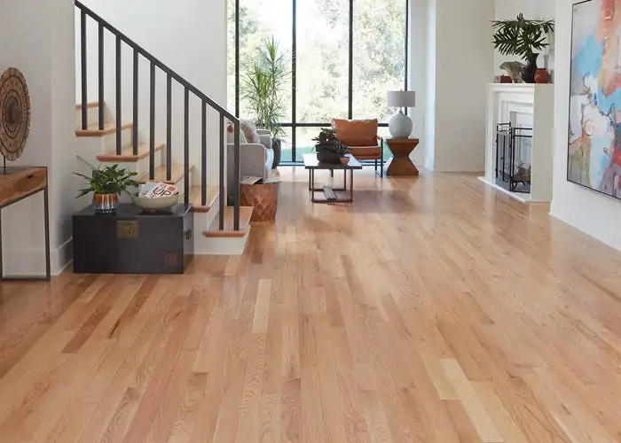 Hardwood flooring features aligned planks and a smooth finished surface across a clean, even installation.