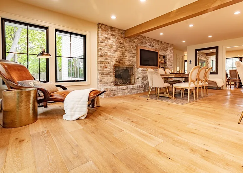 Hardwood flooring features aligned planks and a smooth finished surface across a clean, even installation.