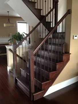 Dark wood staircase with a classic design.