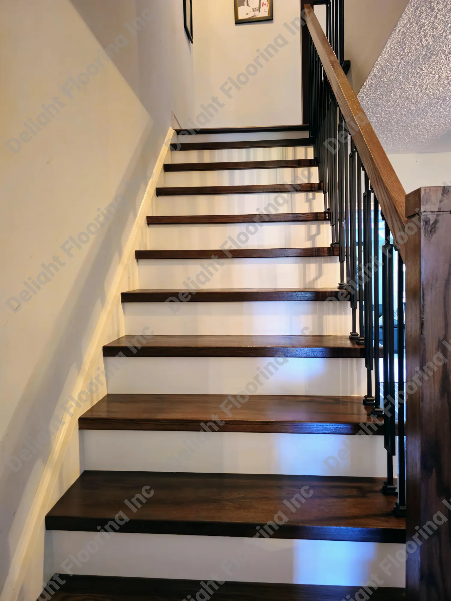 Hardwood staircase showing finished wood treads, risers, and nosing.