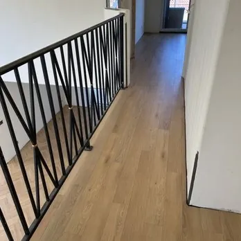 Laminate flooring shows a consistent pattern across the installed area.