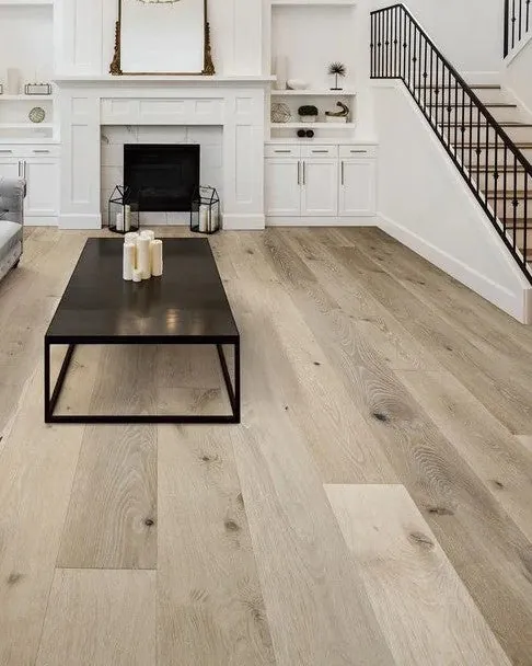 Laminate flooring shows a herringbone layout and a consistent pattern across the installed area.