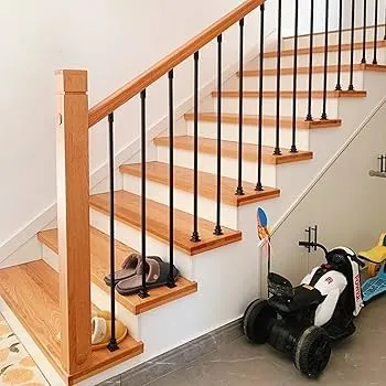 Staircase with wooden railing and black metal handrail.