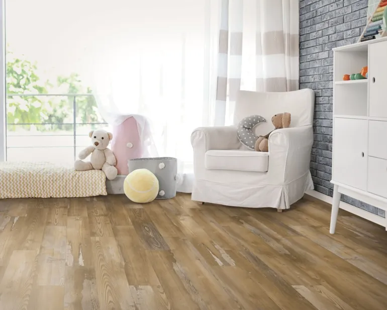 Vinyl plank flooring shows a diagonal layout and visible grain across the installed area.