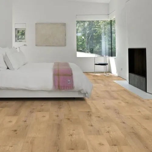 Vinyl plank flooring shows a herringbone layout and a consistent pattern across the installed area.