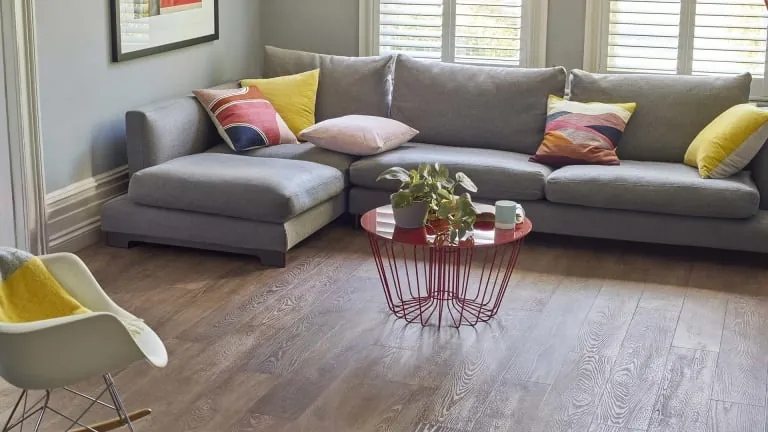Vinyl plank flooring shows a diagonal layout and a consistent pattern across the installed area.