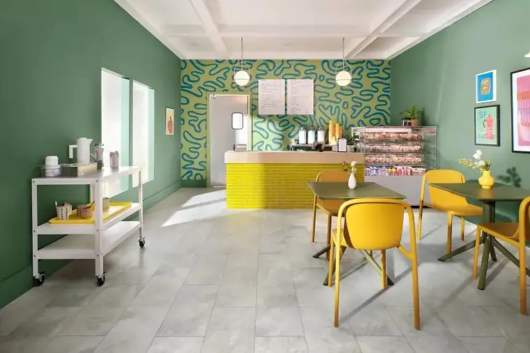 Yellow chairs and tables on a vinyl plank floor.